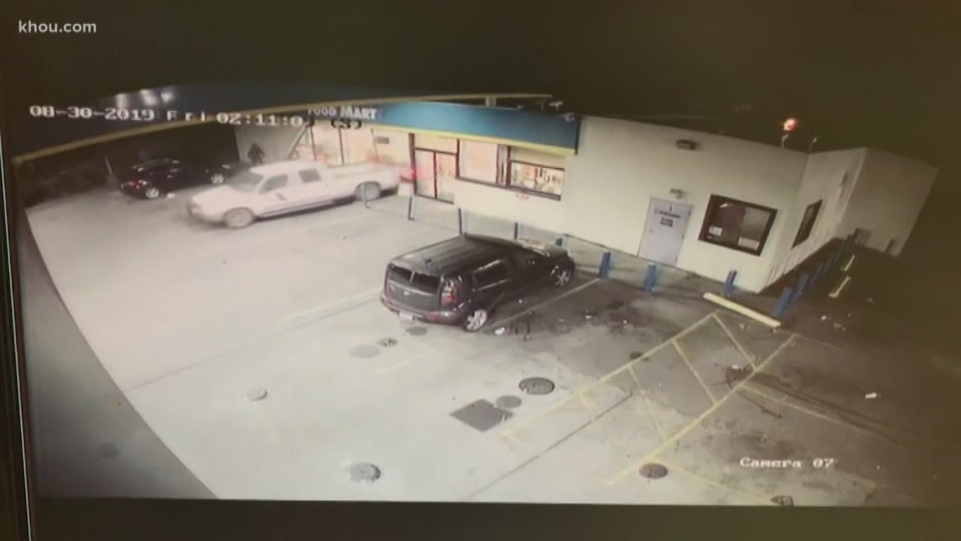 A clerk opened fire on a group of burglars who attempted to steal an ATM by smashing a truck into a store front with customers inside overnight.