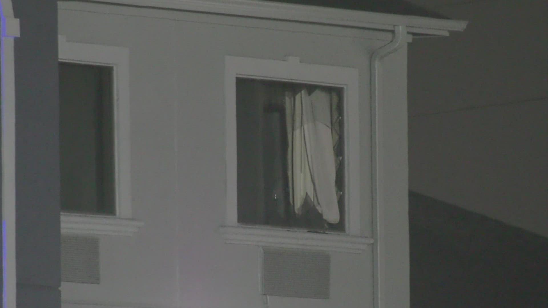 Breaking Barricaded suspect, holding two people hostage, fires shots