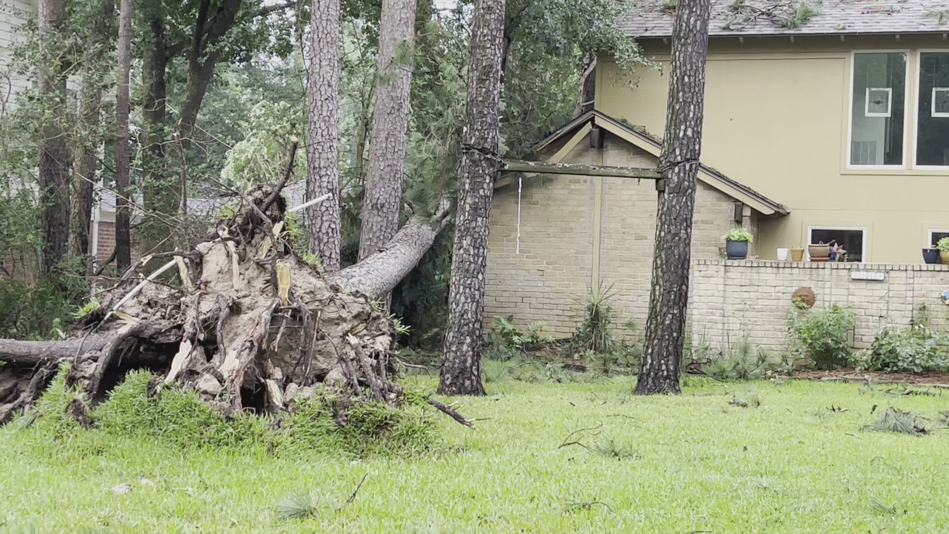 Uprooted tree falls on part of home near Spring, Texas
