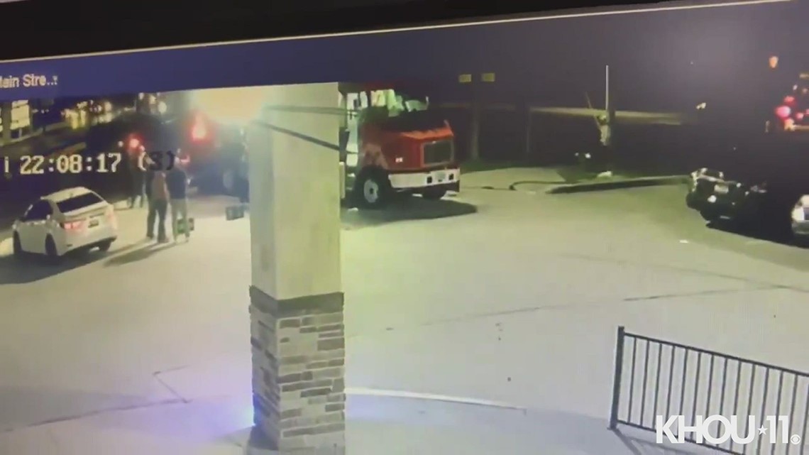 Surveillance video shows driver run red light, crash into food truck ...