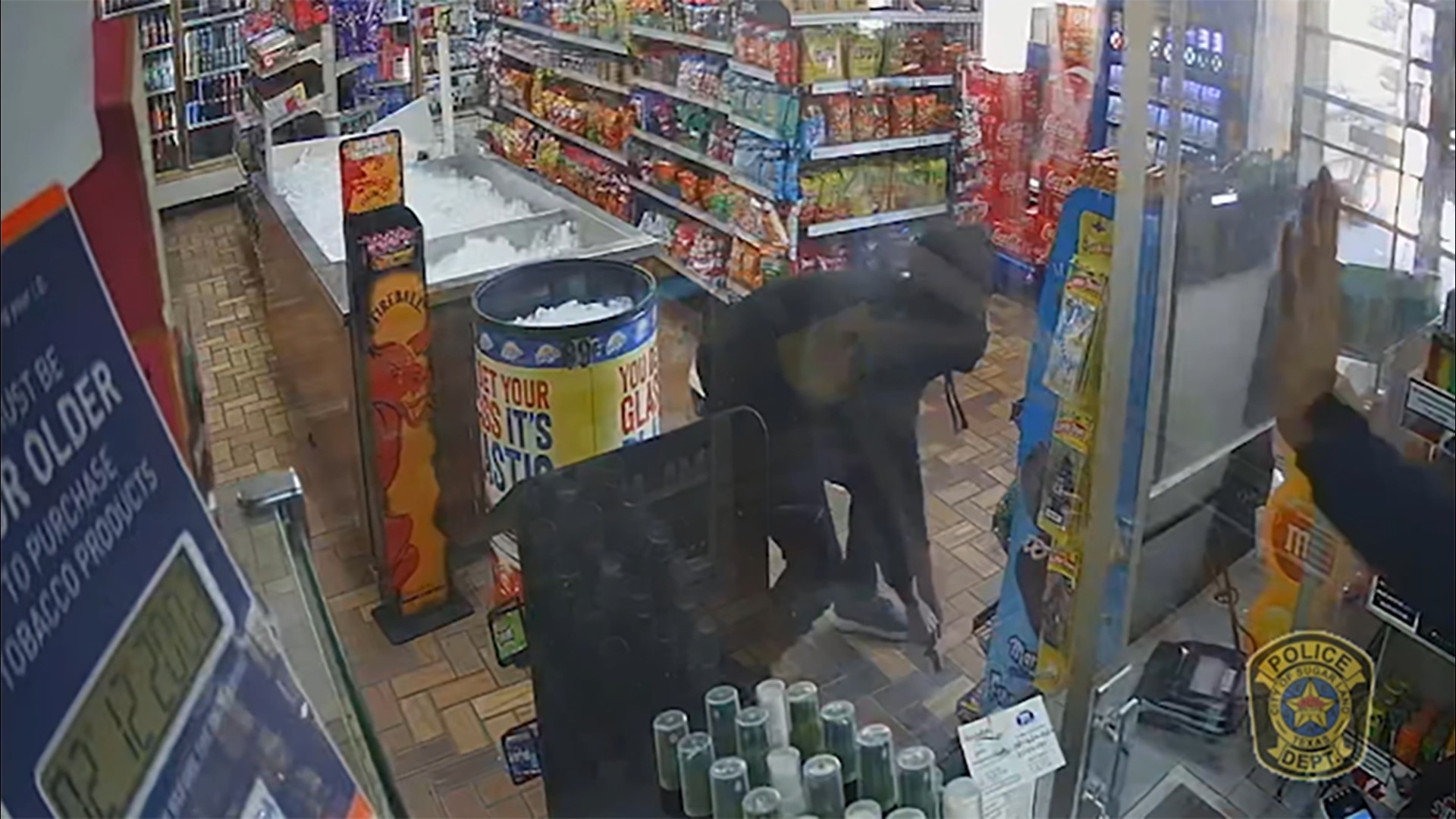 In the video, you can see the robber take cover and then run out of the store when he saw the gun in the clerk's hands.