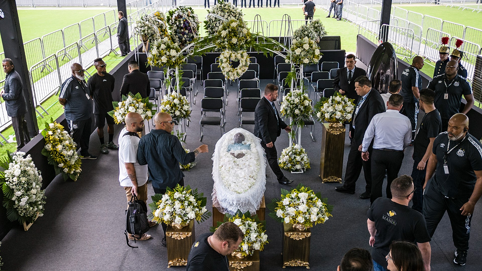 Mourners began paying their respects to Pelé in a solemn procession past his coffin at the Vila Belmiro Stadium in his hometown of Santos.