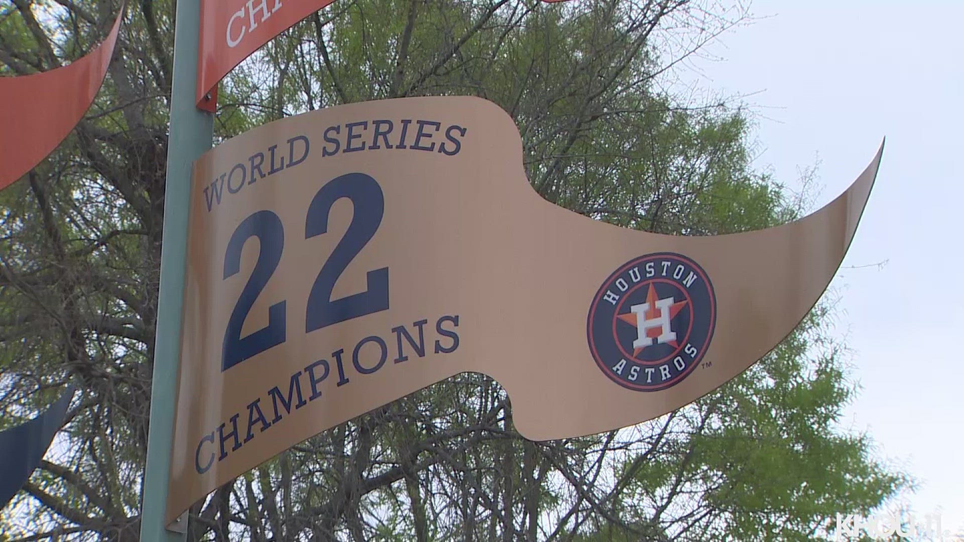 The gold pennant signifying the 2022 World Series Championship has been hung outside of Minute Maid Park.
