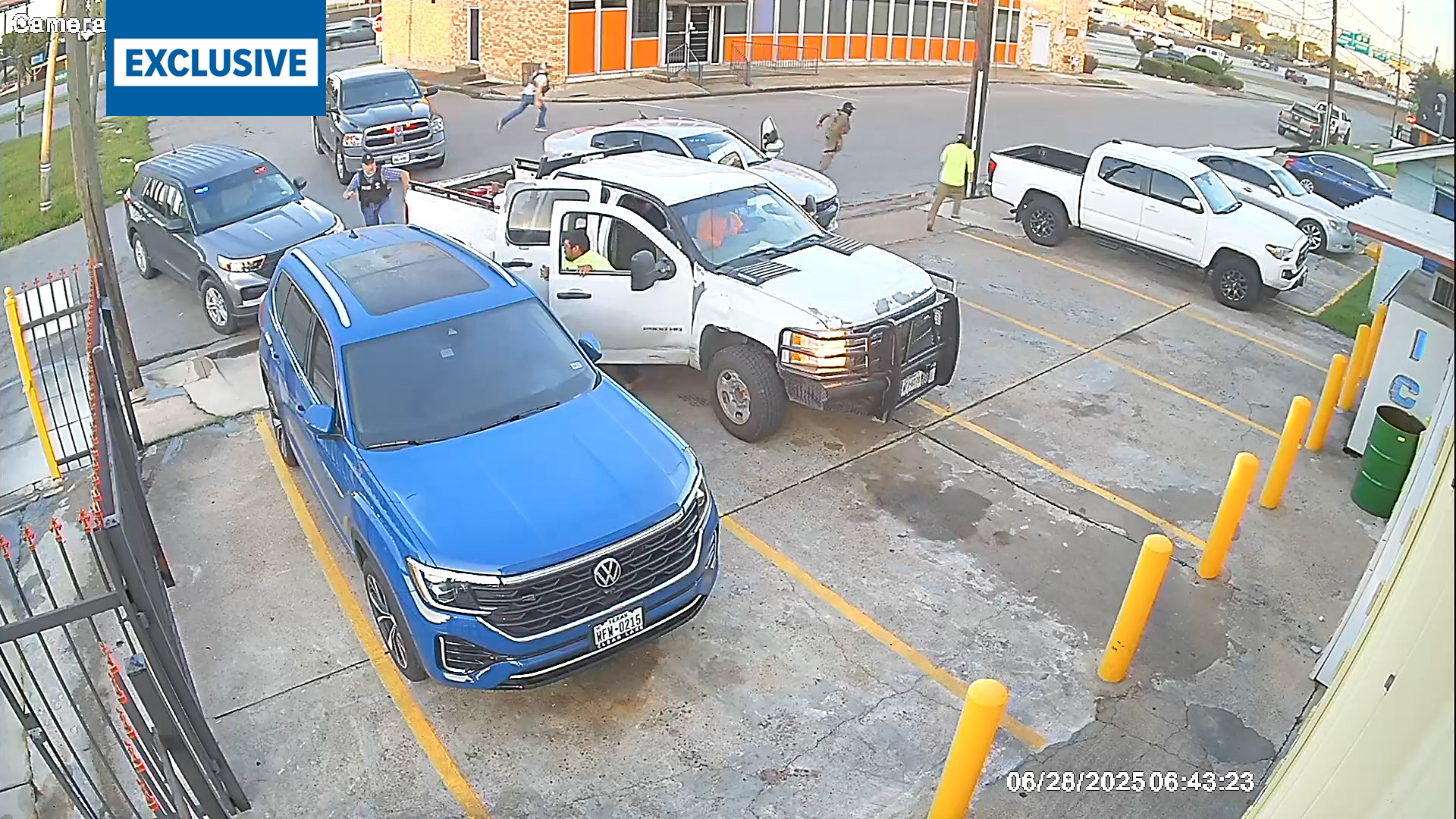 Surveillance video shows unmarked vehicles surrounding a pickup truck on I-45 South feeder road Saturday morning. Men jumped out and ran as agents chased them.