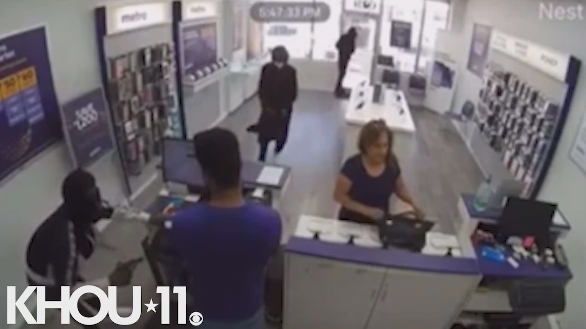 A 65-year-old woman suffered a concussion after she was thrown to the ground by men robbing a cellphone store in southwest Houston.