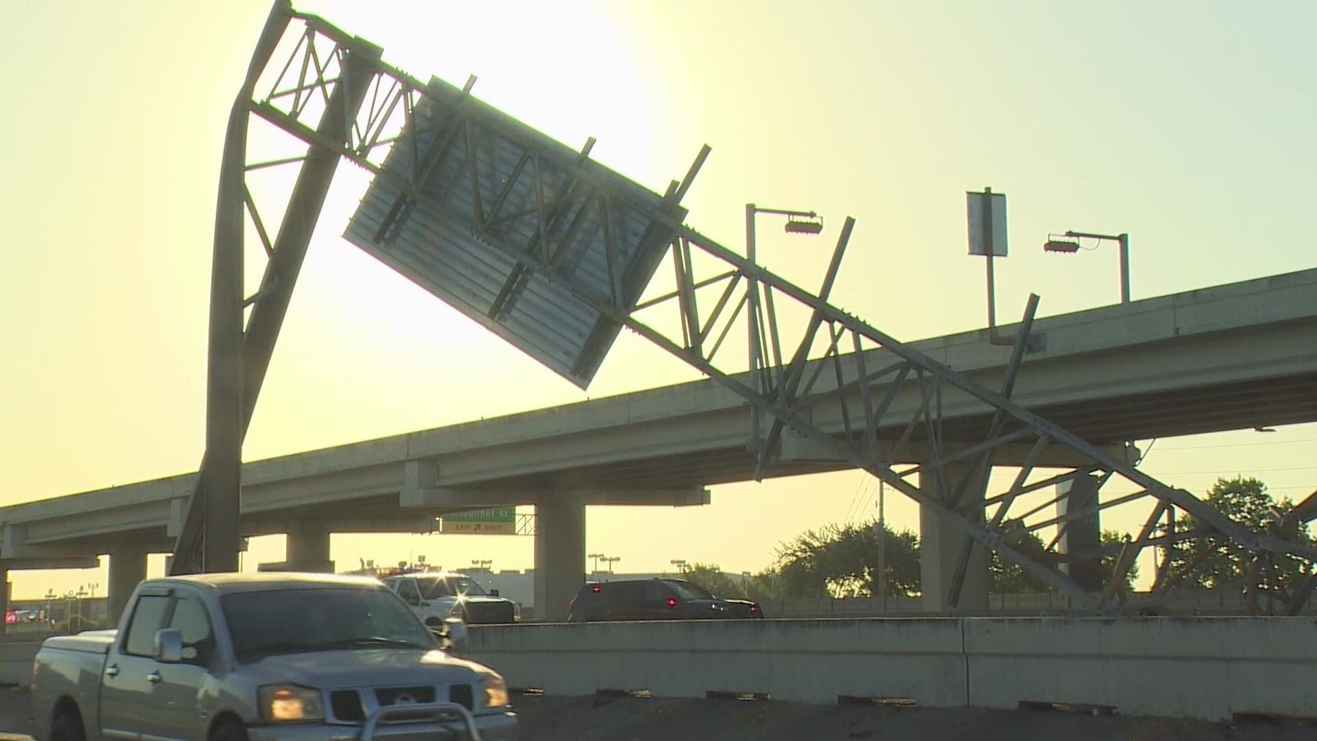 An overturned 18-wheeler has the outbound lanes of the Southwest Freeway shut down near Bissonnet.