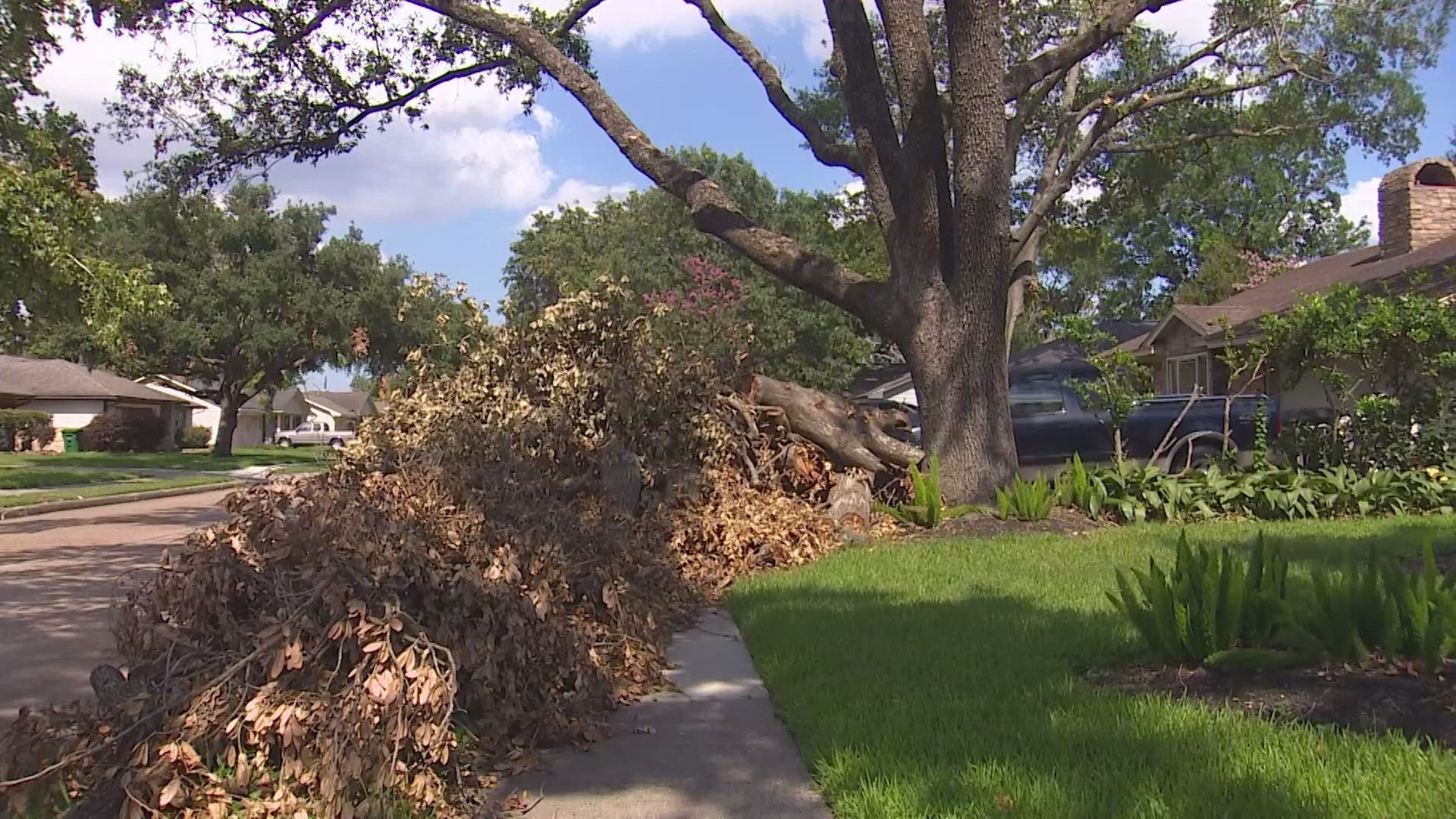 KHOU 11 spoke with Conrad Fertitta two weeks ago about the pile of debris left in his front yard. He's worried that the debris is still there with rain on the way.