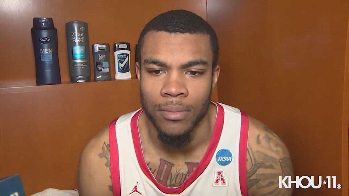 Houston Cougars'  Tramon Mark and Reggie Chaney react to the Sweet 16 loss to Miami