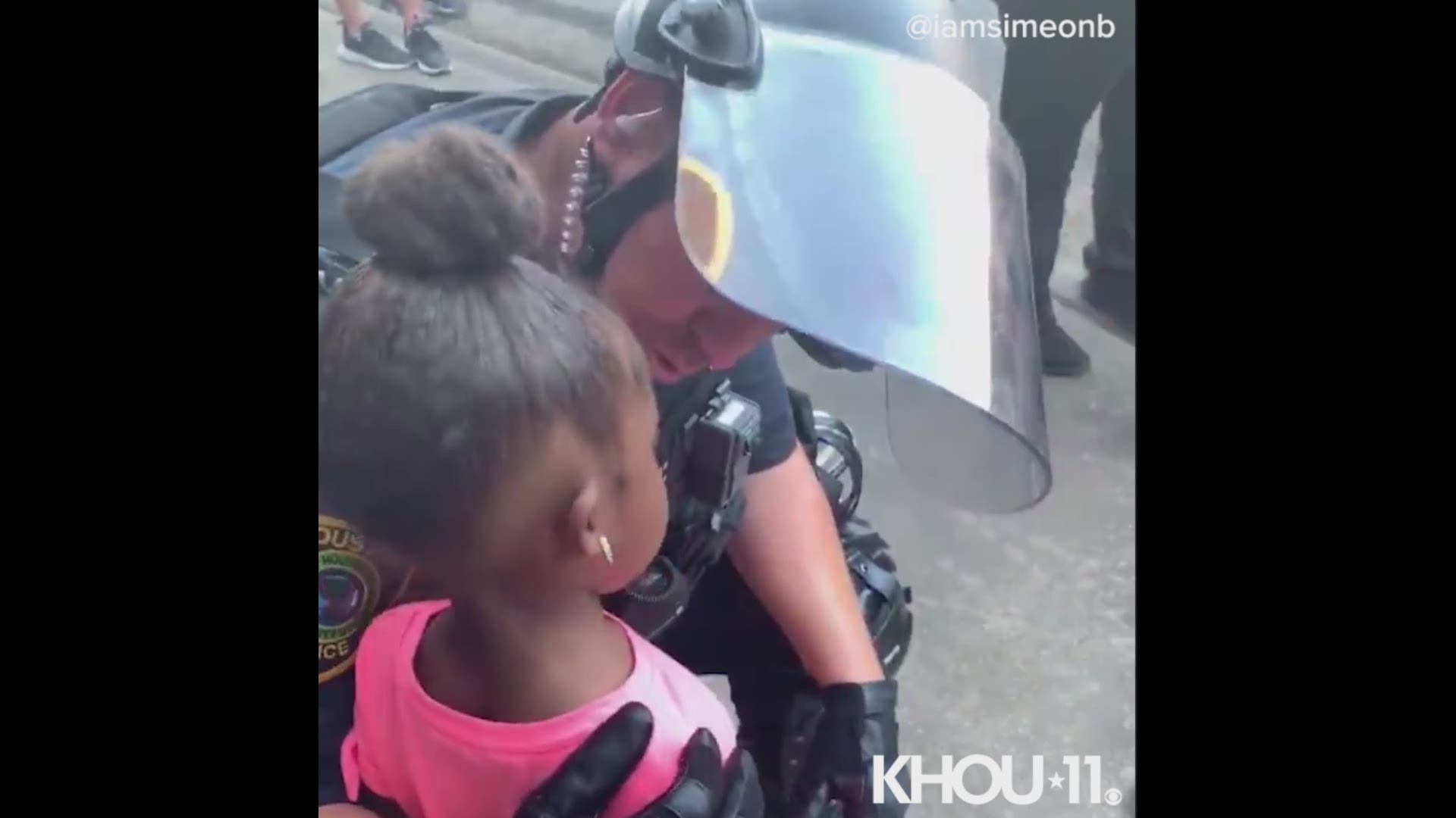 An HPD officer had some comforting words for a little girl who was crying during the march on June 2.