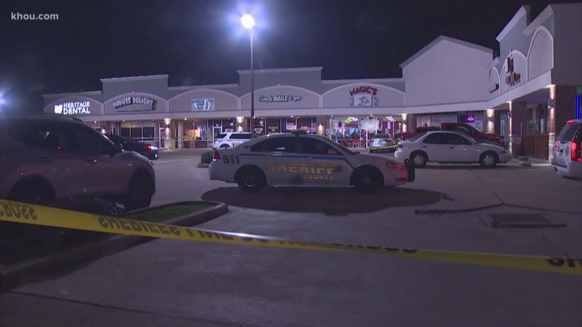 A father is on the run and a barber is in the hospital after a bizarre shooting in Katy.