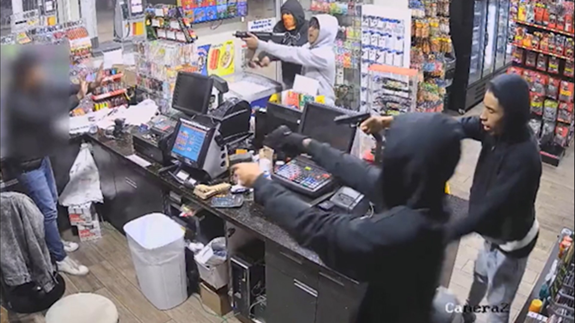 The four suspects all pulled out their guns when they walked into the store on May 17.