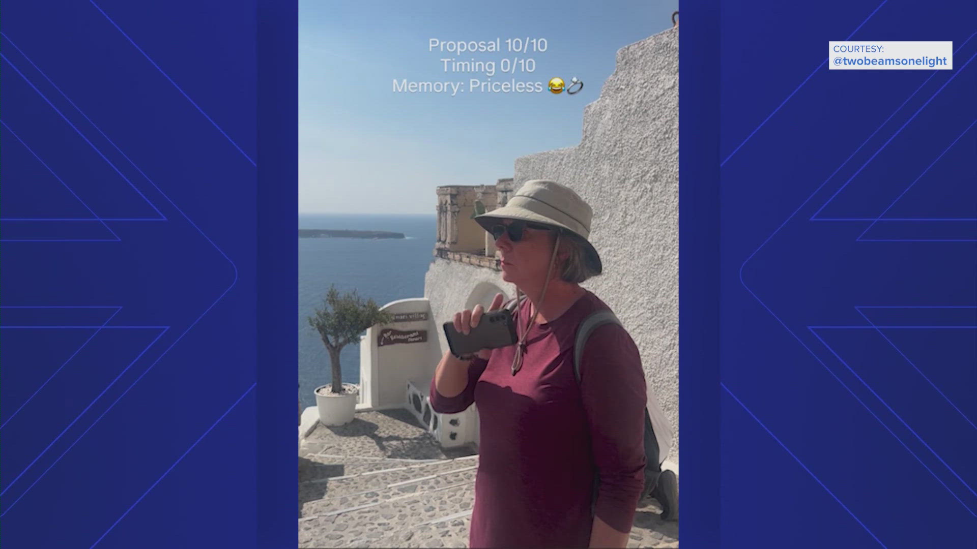 A Miami couple were in Santorini where the man set up a camera. But tourists walk in front, blocking the camera shot.