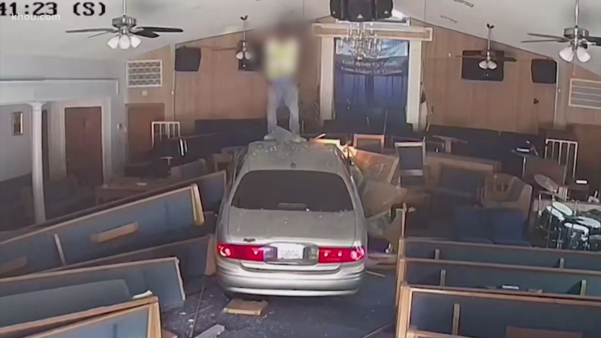 According to Houston police, the suspect tried to run away after slamming into the church and jumping on top of the car. It was captured on church suveillance.