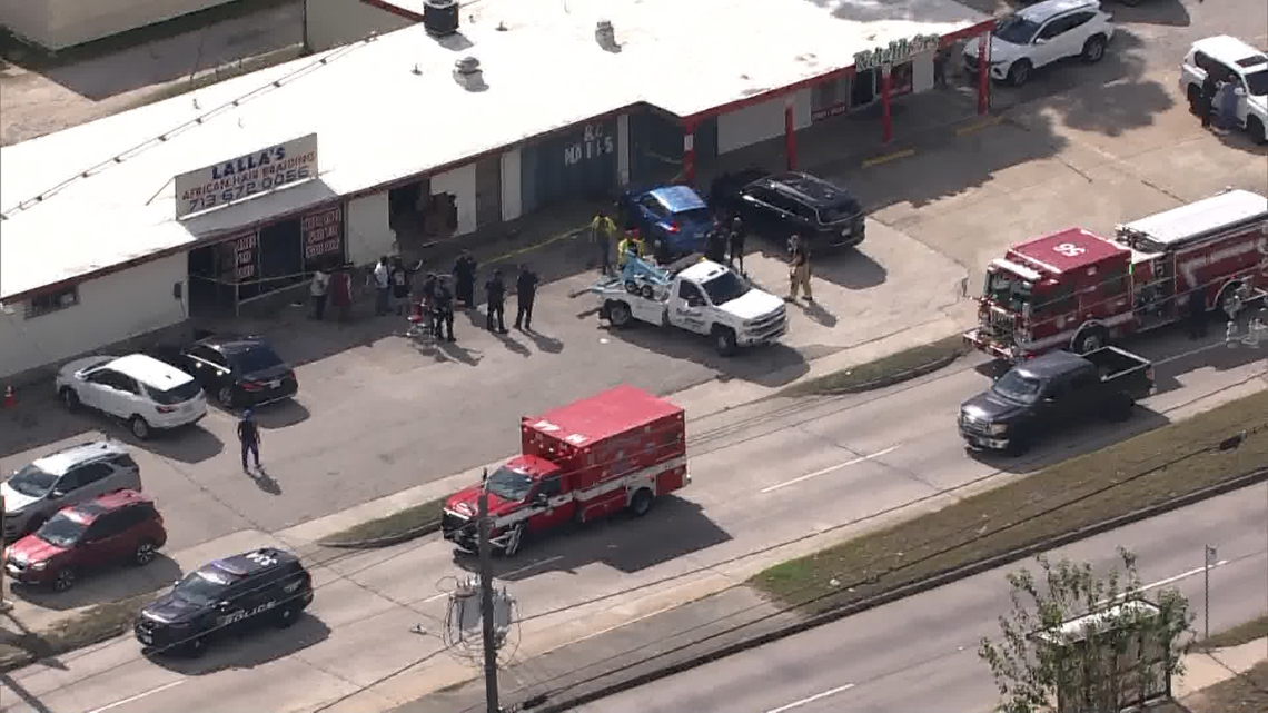 Person rushed to hospital after car crashes into northeast Houston business, police say