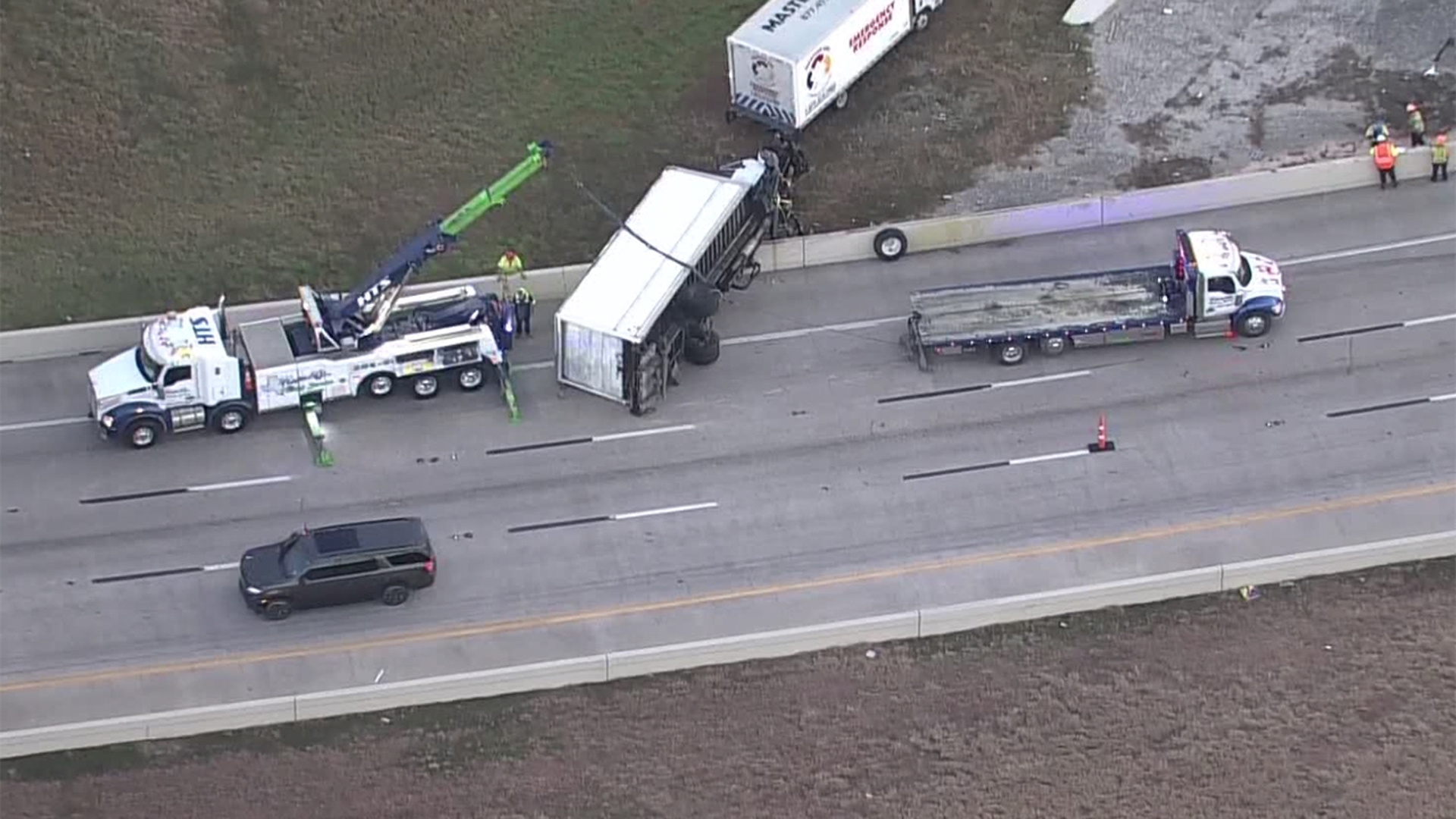 Overturned 18-wheeler blocks inbound lanes of East Freeway near Eastex ...