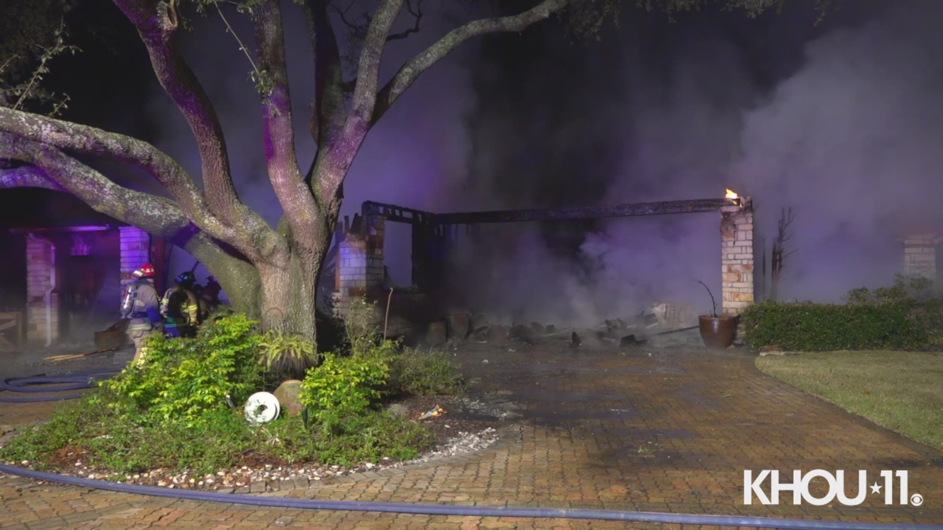 Firefighters are battling a fire at a house fully engulfed in flames in northwest Harris County Friday morning.