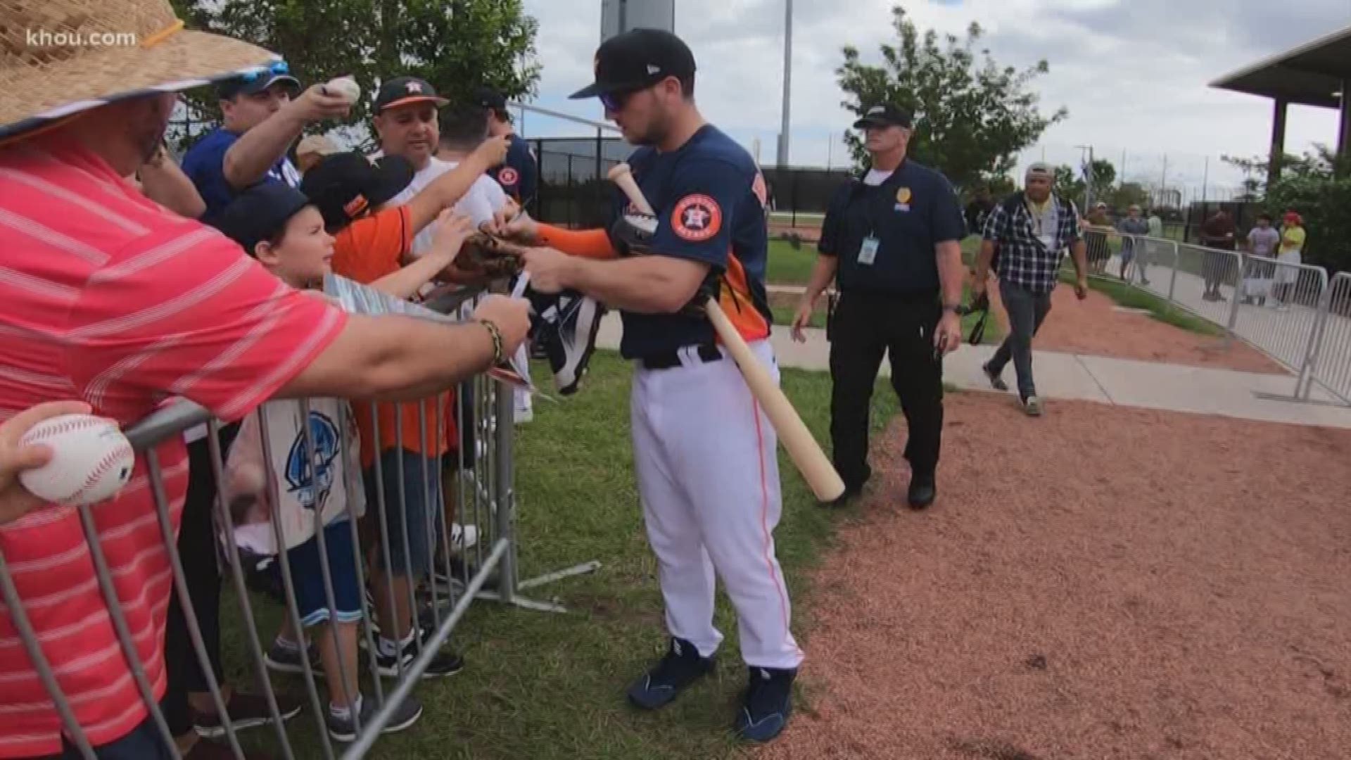 Fans heckling Astros spring opener get signs stolen