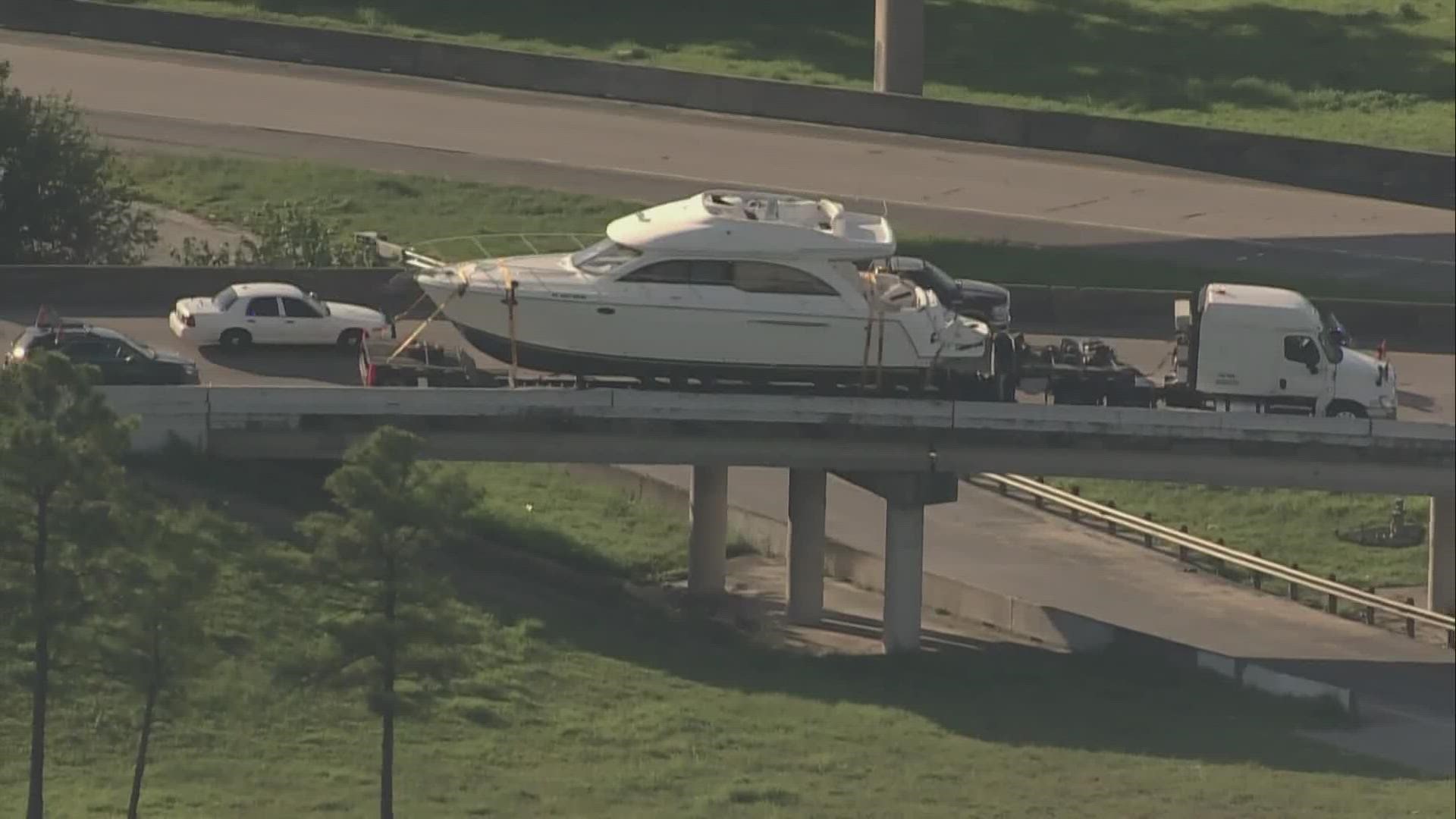 A truck towing a boat wasn't going to make it under a bridge at 610 and the Gulf Freeway, so it had to get off the ramp, causing a traffic backup.