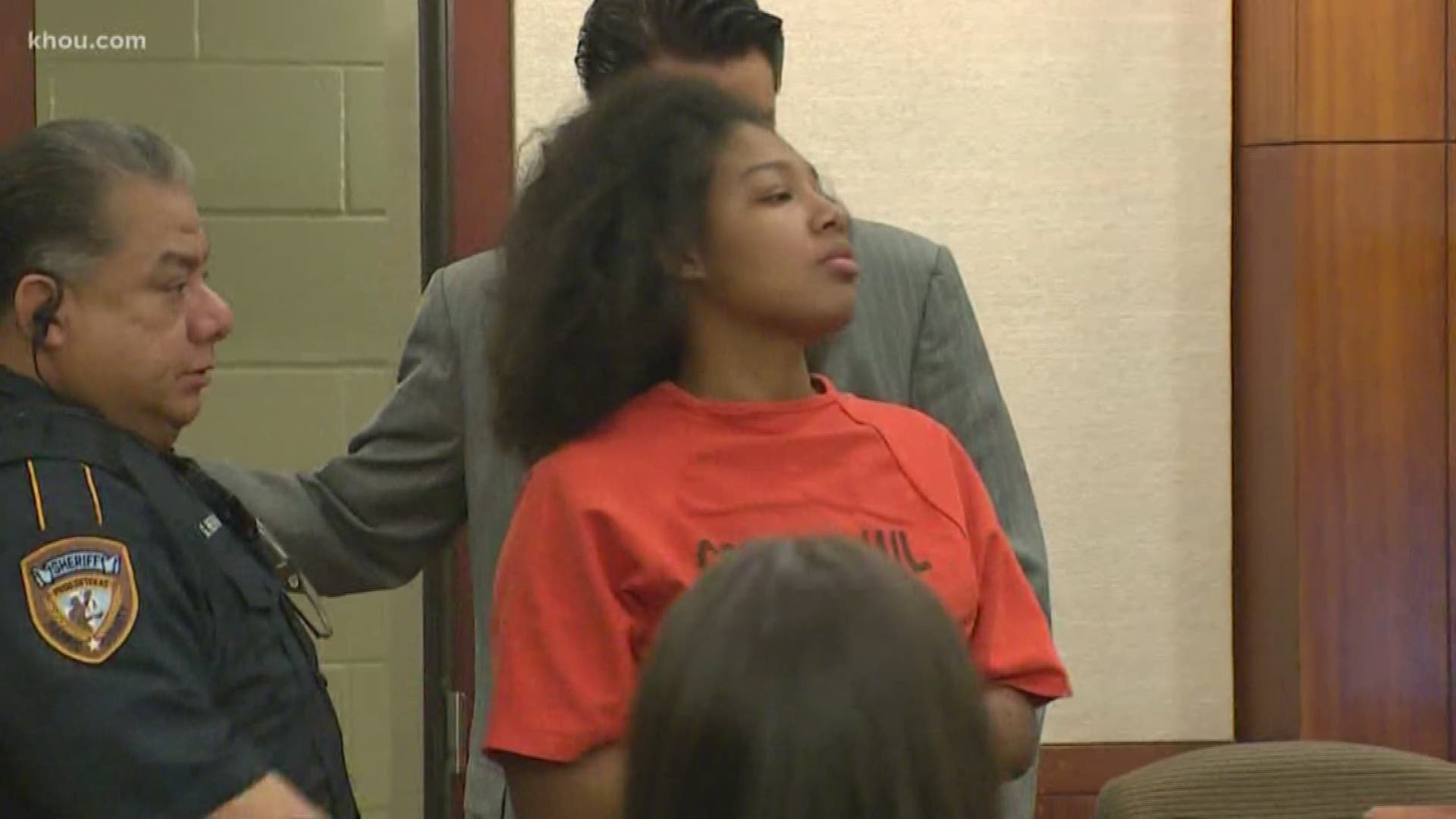A 20-year-old woman was in court Wednesday on charges in connection with a fatal hit-and-run crash that left two people dead in the Heights last month.