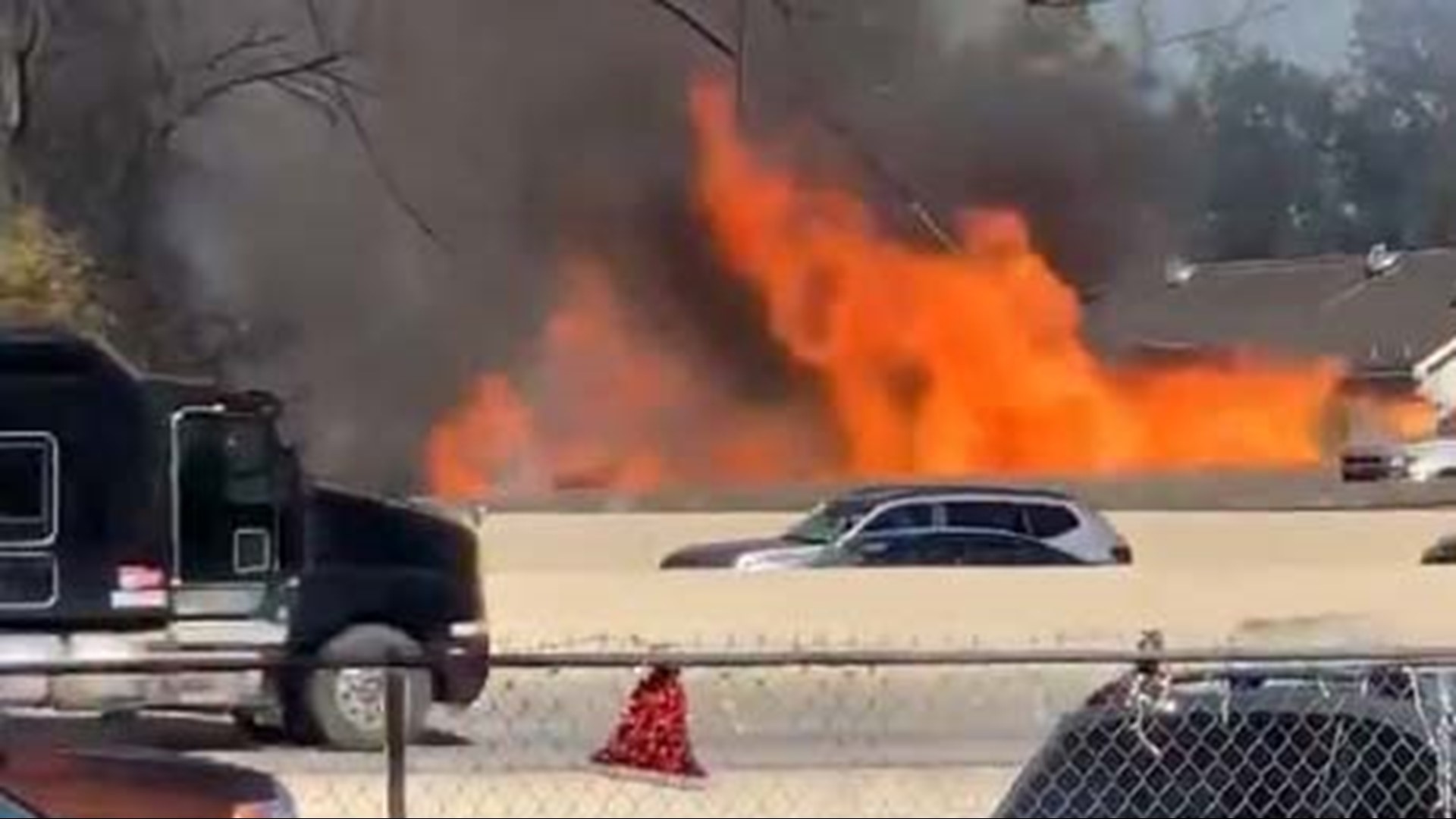 An 18-wheeler burst into flames on the North Loop East feeder road near the Hardy Toll Road. One person was killed and the fire spread to a nearby house.