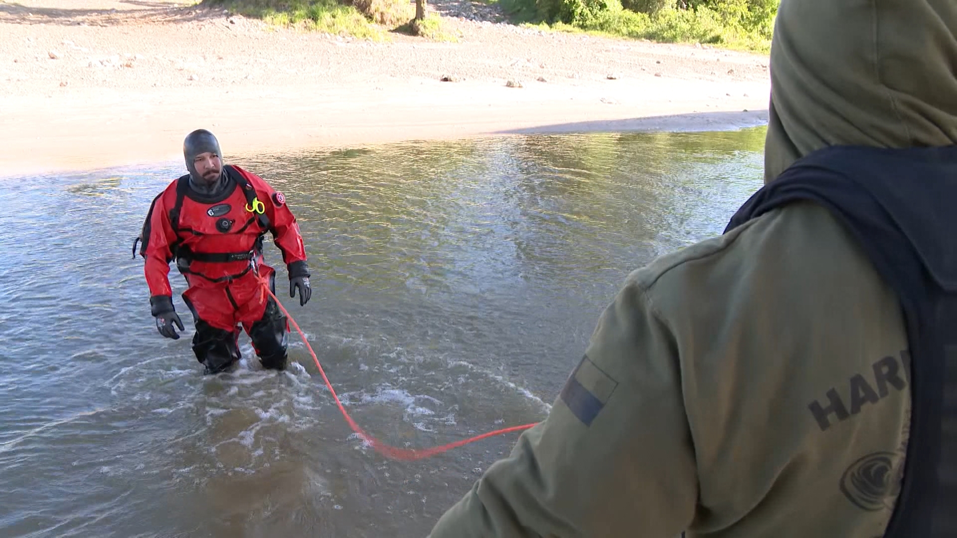 Harris County Sheriff's dive team scours San Jacinto River for discarded gun. The specialized unit demonstrates their meticulous underwater search techniques.