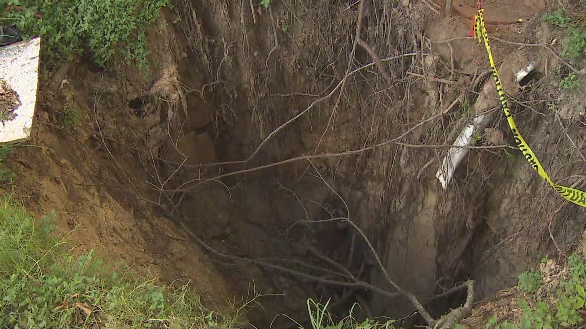 A hole continues to grow in a northwest Harris County neighborhood. As it gets bigger, so do the concerns of residents.