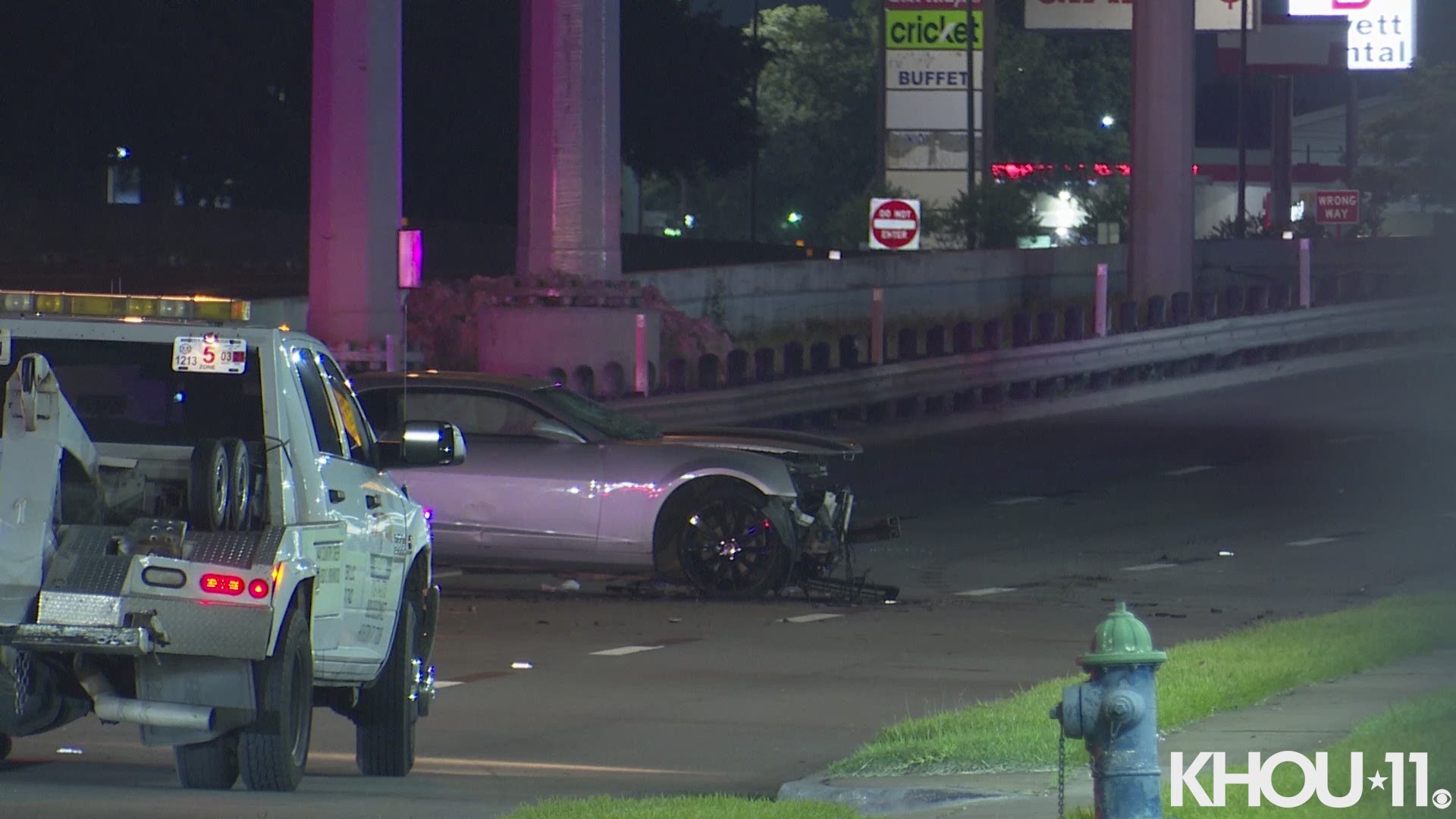 A woman lost her arm in a suspected street racing crash on the Southwest Freeway near Gessner. Three others were also injured.