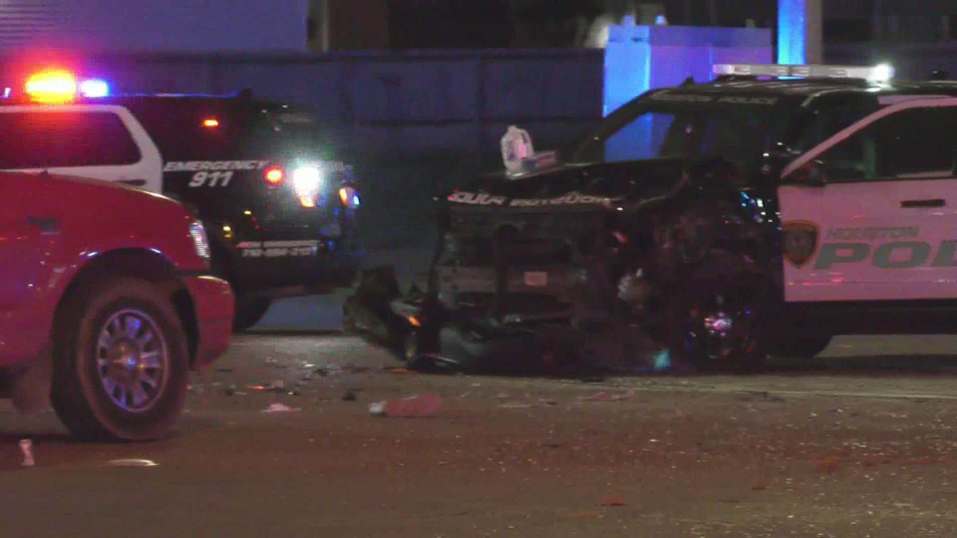 The Houston Police Department said an intoxicated woman was arrested early Sunday morning after running a red light and causing a crash involving two officers.