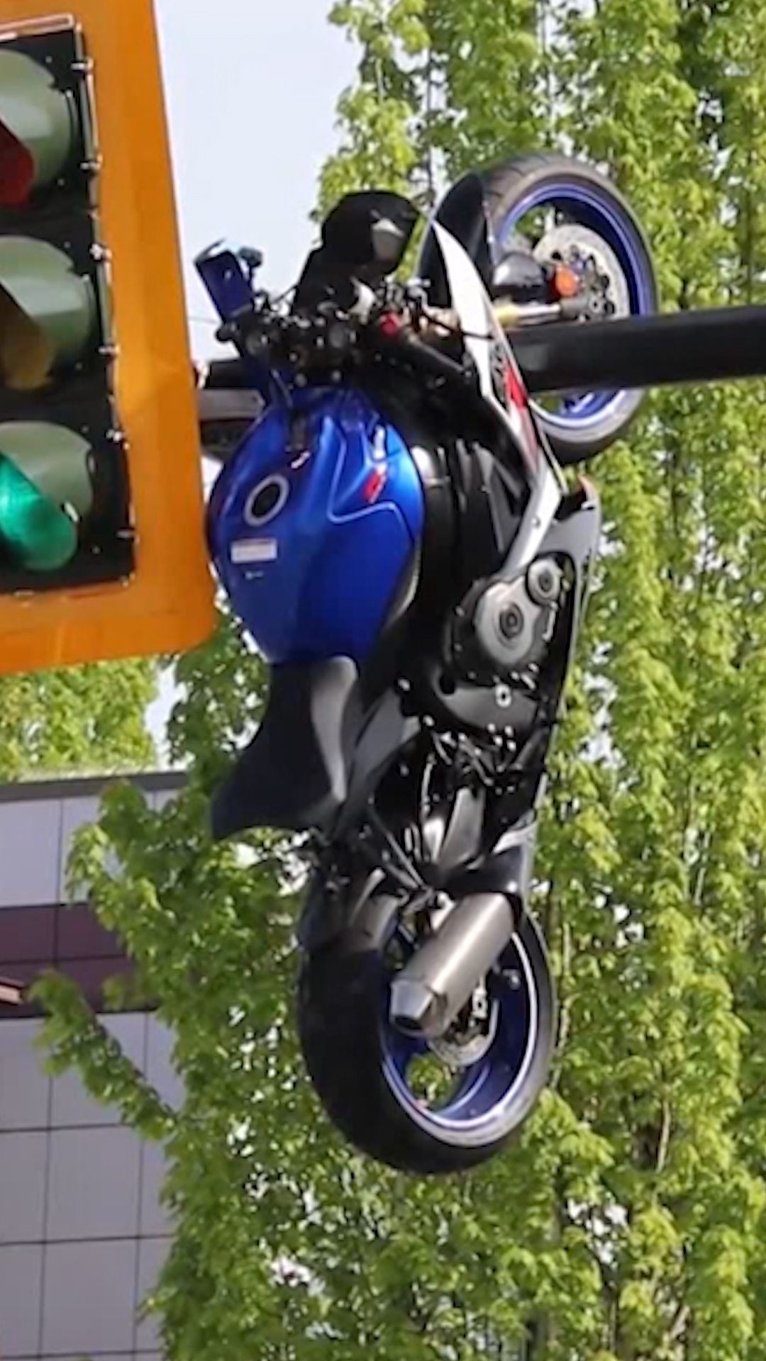 Motorcycle left dangling from traffic light after crash in Canada ...