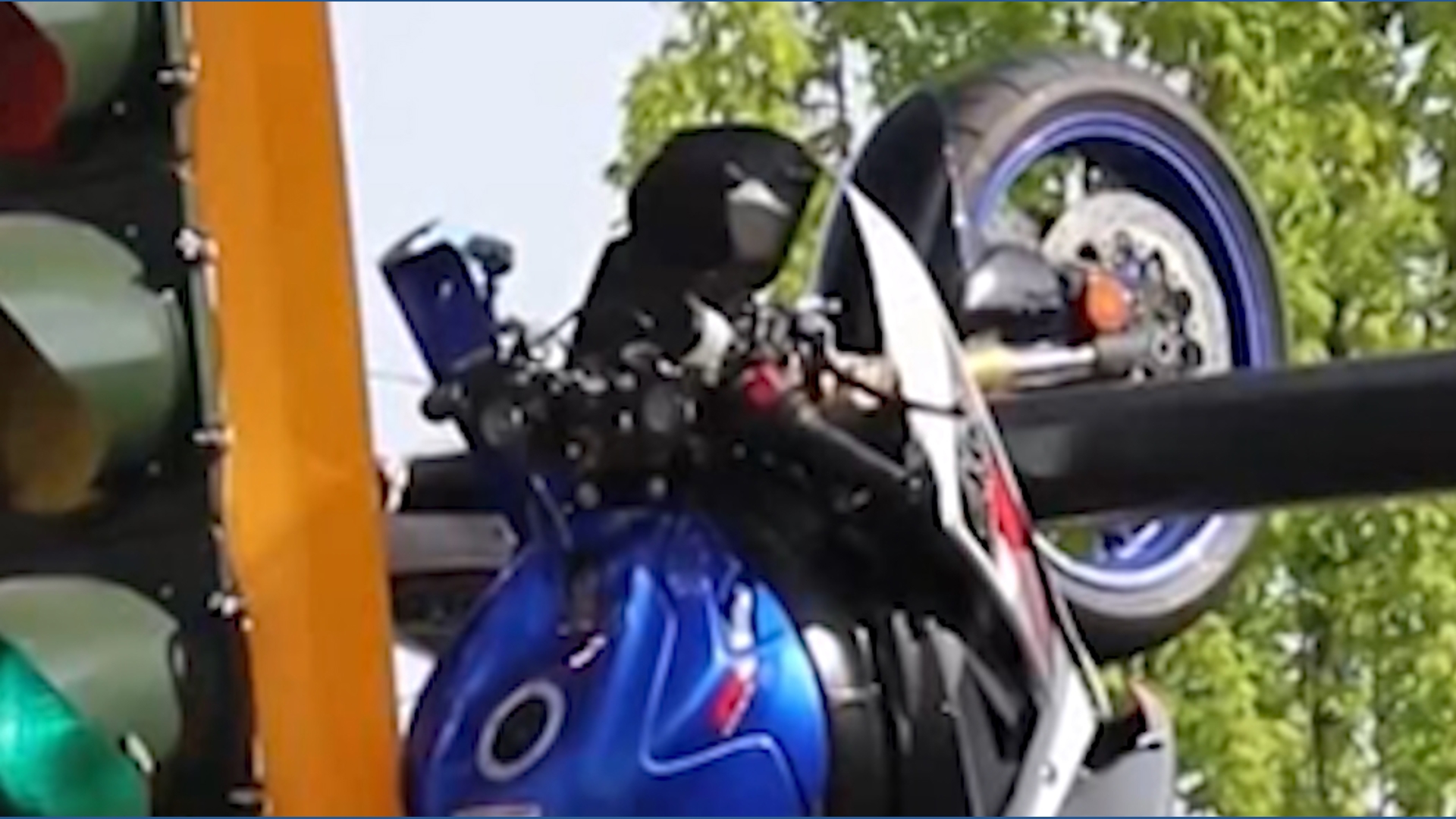 Motorcycle left dangling from traffic light after crash in Canada ...