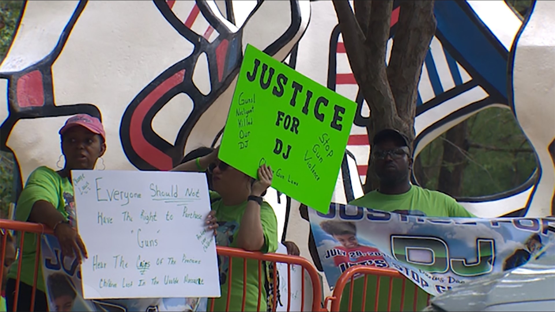 On the final day of the NRA convention in Houston, protesters, including DJ Dugas' mother, gathered outside.