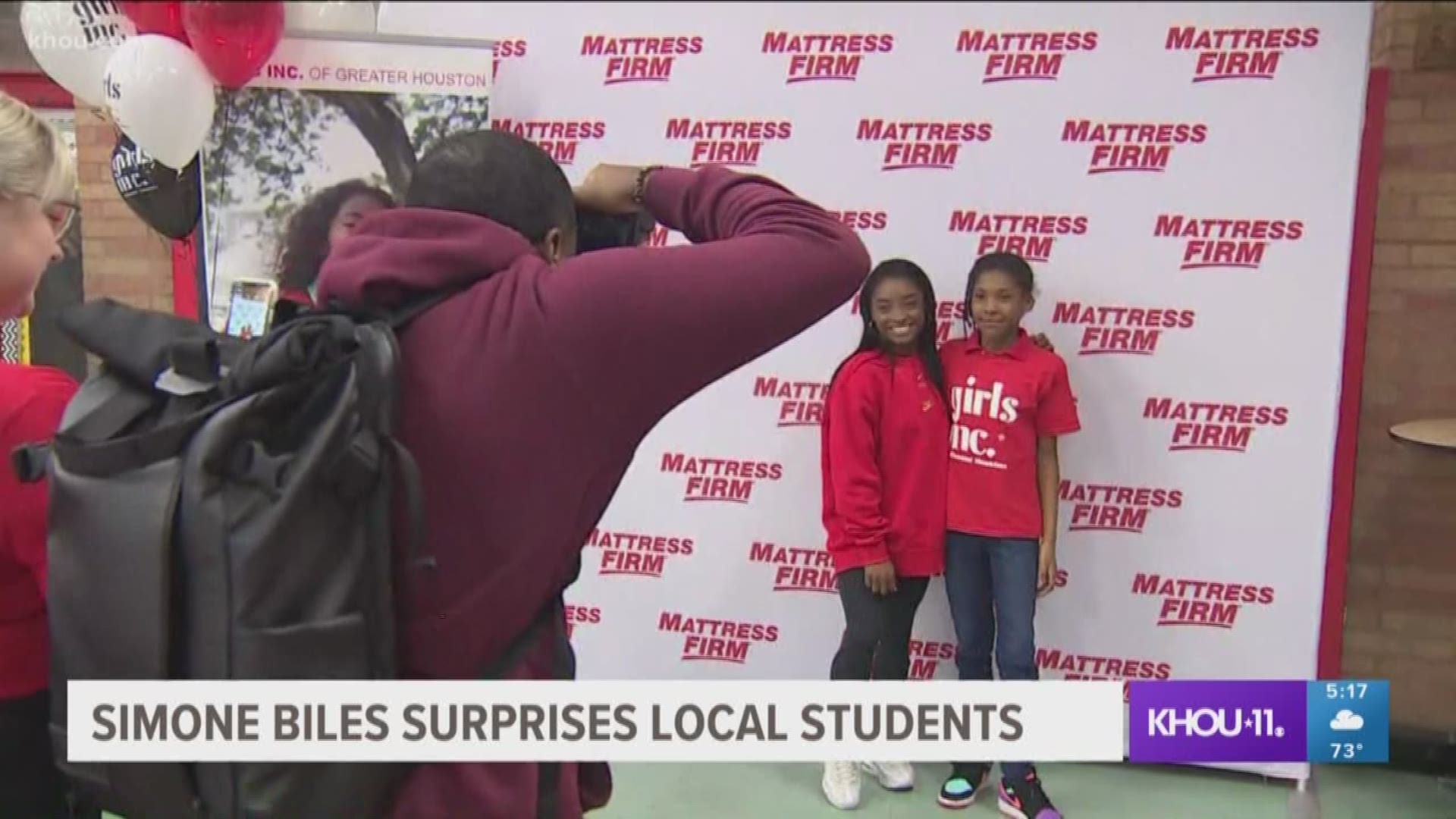 Gymnast Simone Biles surprised students at Nathaniel Q. Henderson Elementary School to share fitness tips, lead a stretch and take photos with them.