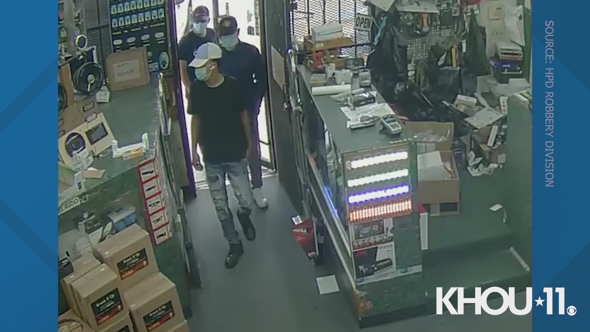 Houston police released surveillance video Wednesday of several men wearing surgical masks while robbing an electronics store in west Houston.