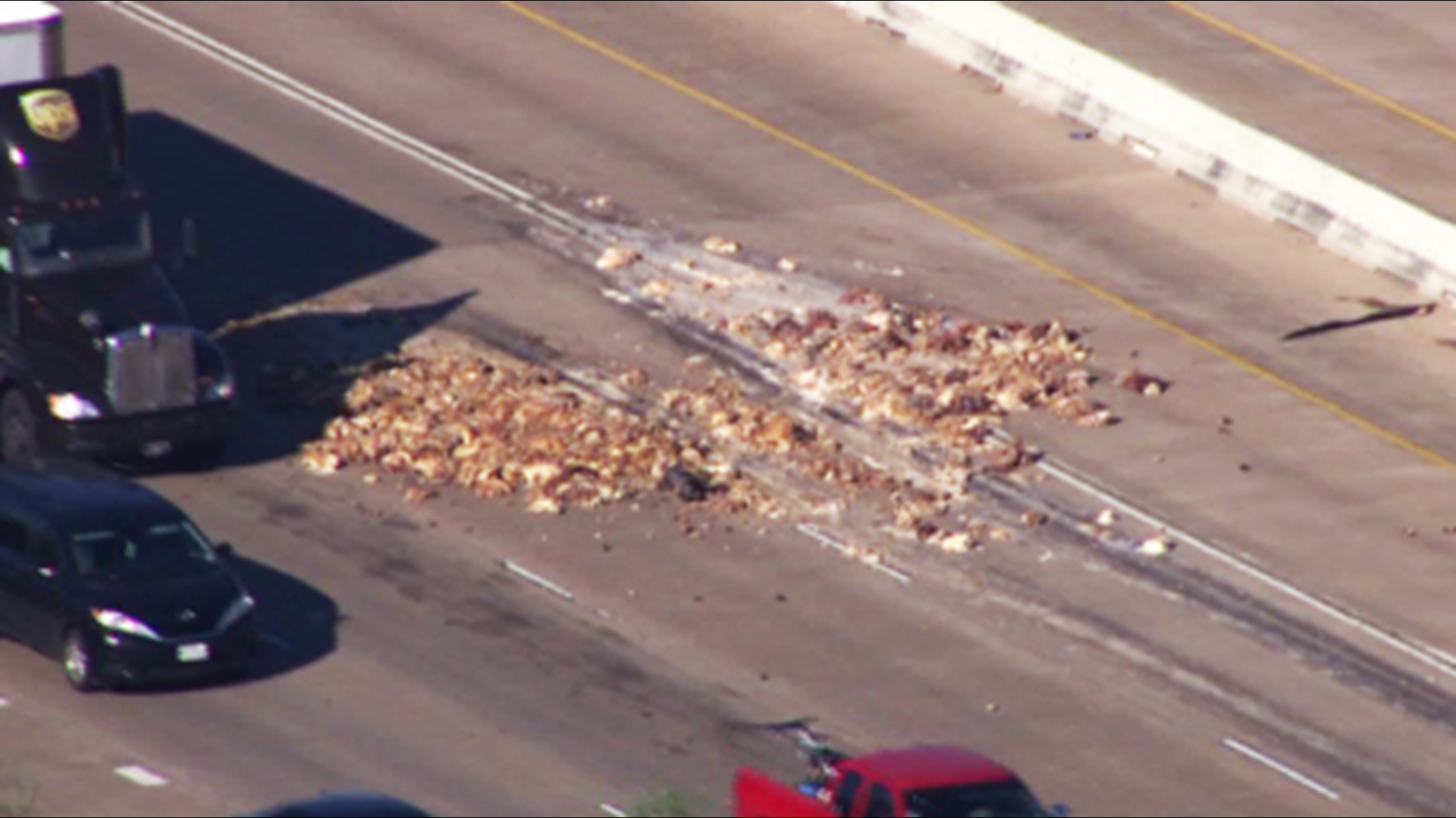 Air 11 is over the Southwest Freeway north of Highway 6 where a truck accidentally spilled pig by-products, city officials say.