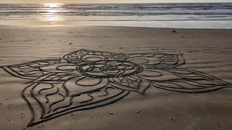 Temporary but powerful: Woman creates detailed art in sand in Port Aransas