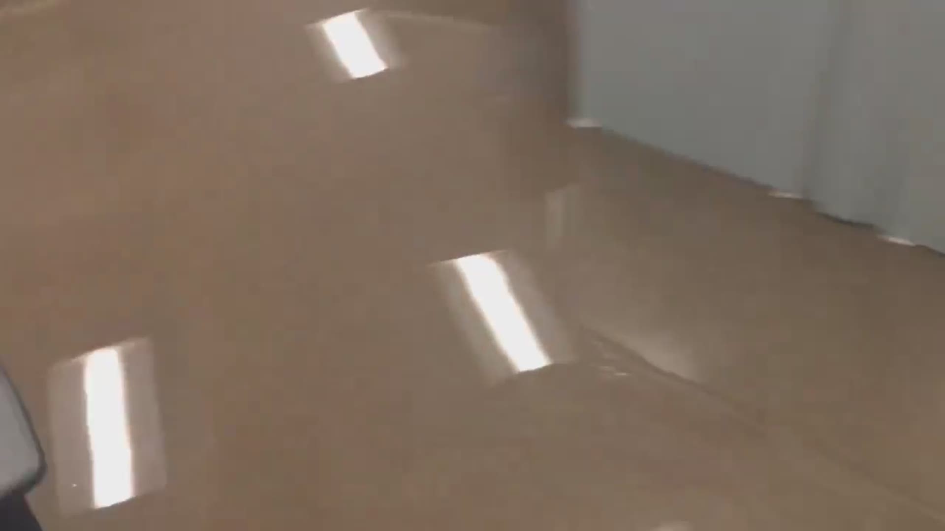 Flooding inside KBMT forces station reporters and employees to higher ground.