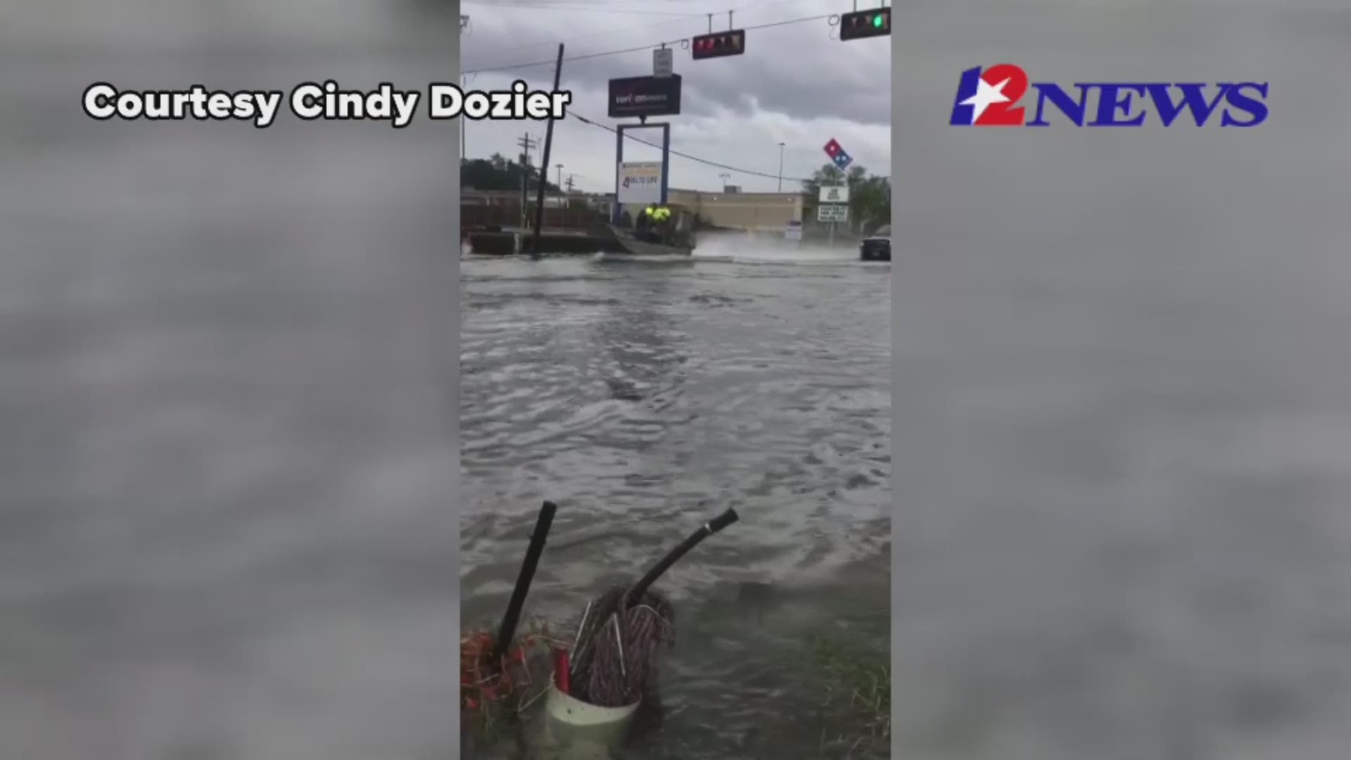 Airboats and trucks are sharing roadways in Vidor, Texas as Imelda slams the region.