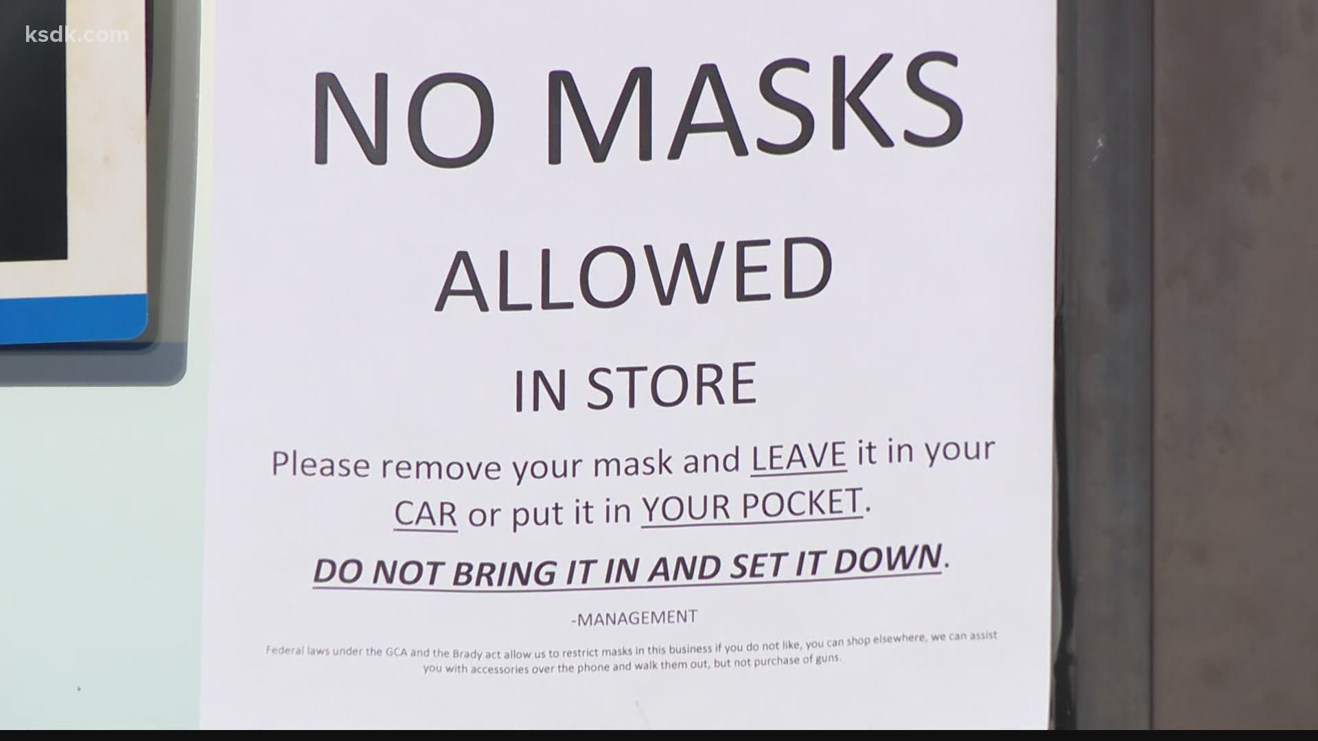 Ian McFarland continues to post a mask ban notice in the window of his gun shop, even as some grow concerned over rising COVID-19 case counts.