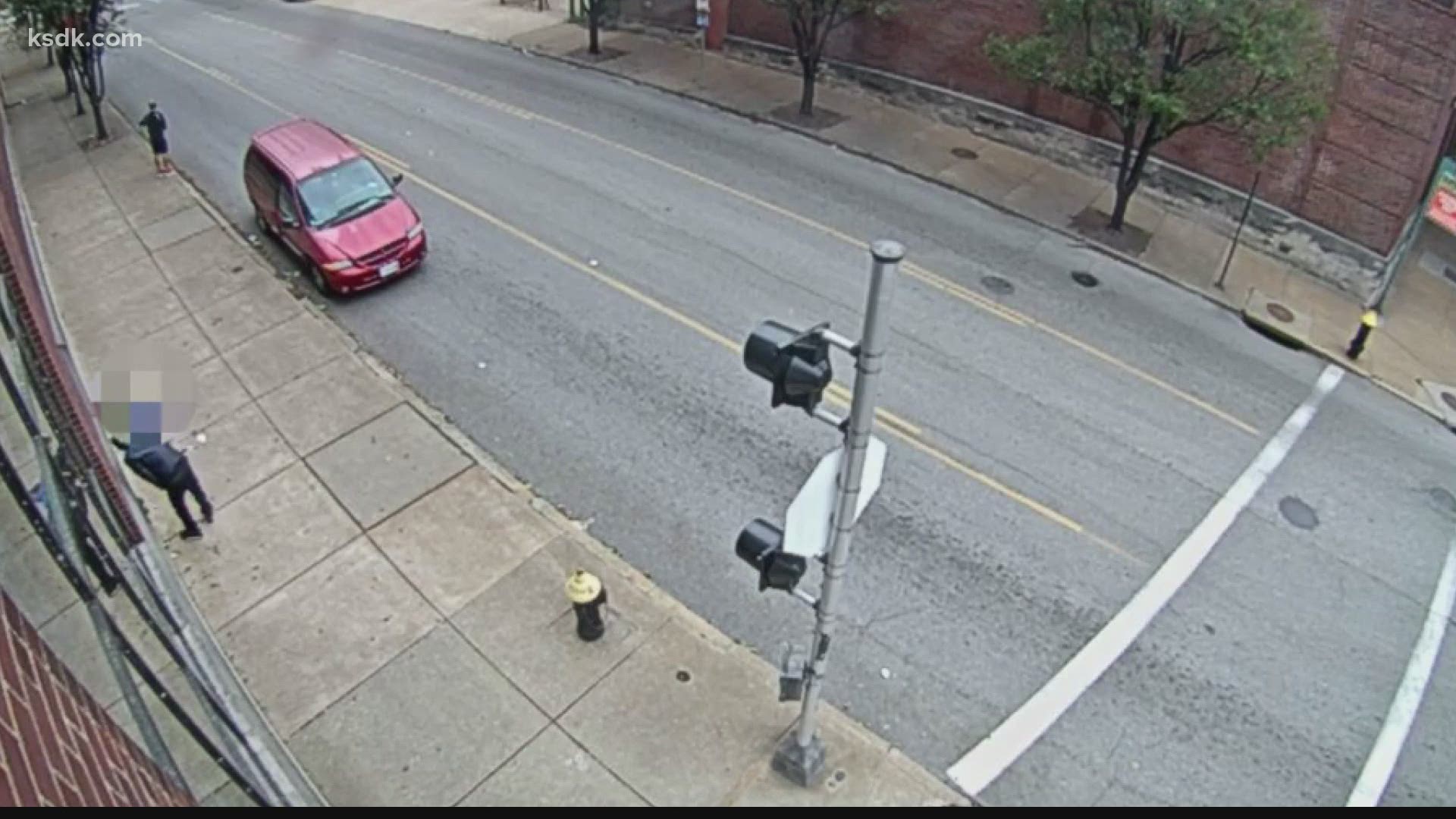 SLMPD released video of the person going up to the woman on the sidewalk and taking her cellphone