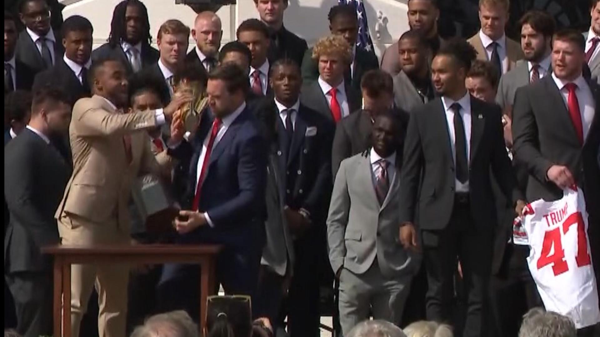 JD Vance almost drops Ohio State national championship trophy | khou.com