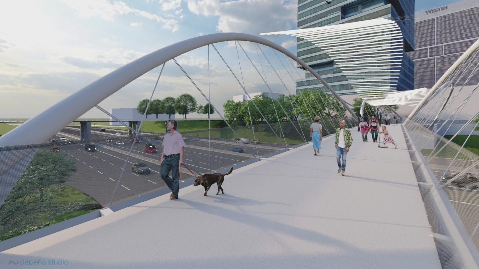The new bridge will provide a pedestrian crossing over I-277 and features 40-foot-tall double arches.