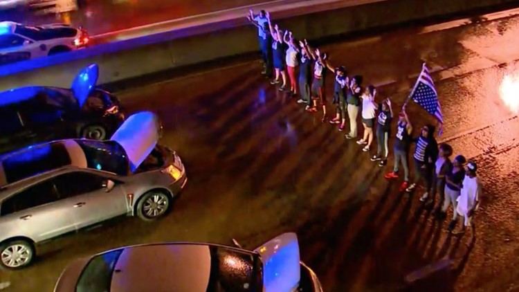 Dozens protest over Botham Jean shooting, briefly shutting down I-30