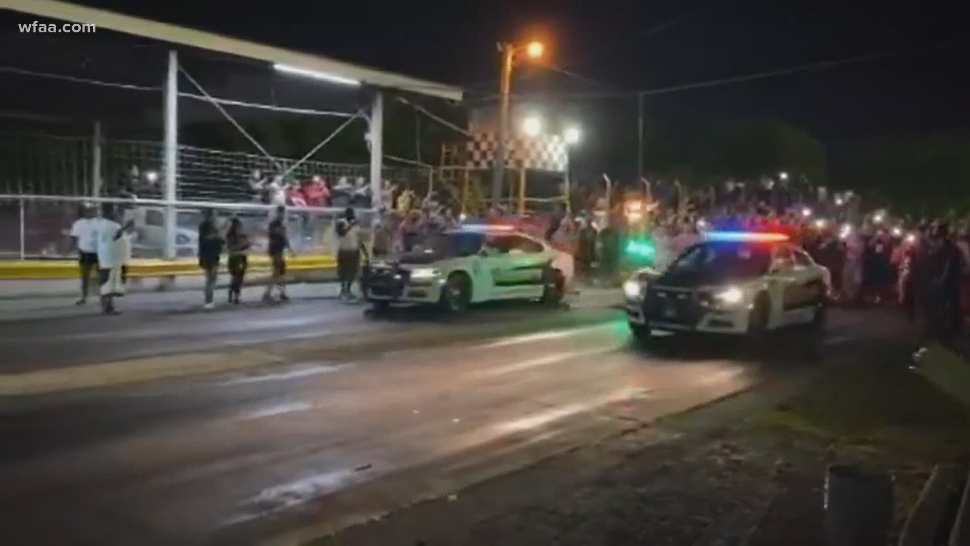 Viral video shows two Dallas County Sheriff's patrol vehicles racing before a crowd at a drag strip in North Texas.