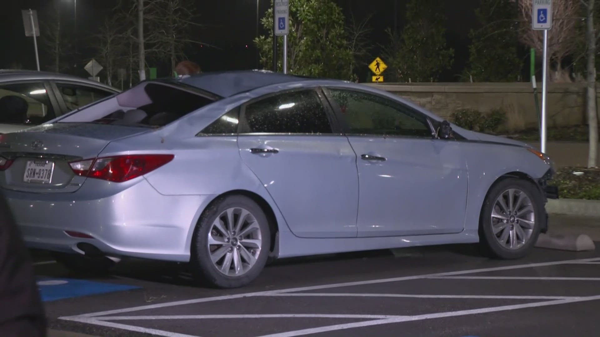 Witnesses said a possible tornado lifted the car across the parking lot.