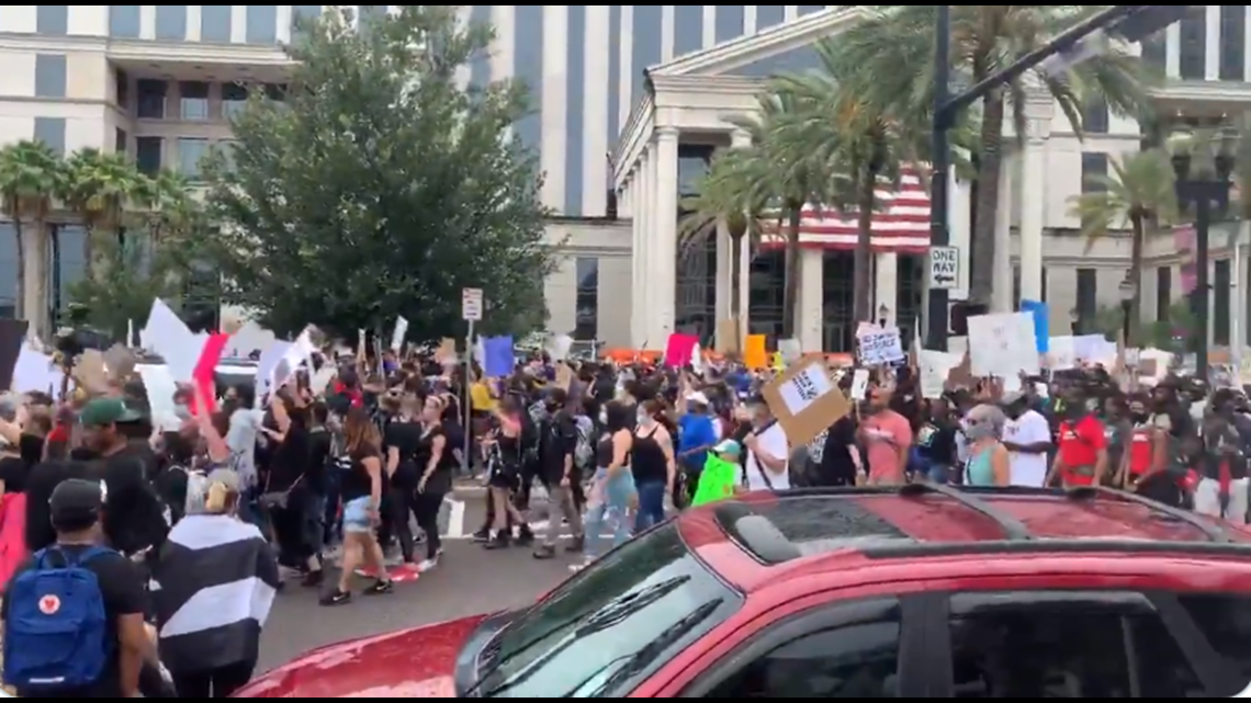 WATCH Thousands protest, march in Downtown Jacksonville calling for